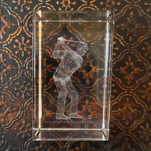 3D laser-engraved glass paperweight featuring a golfer in a swinging pose